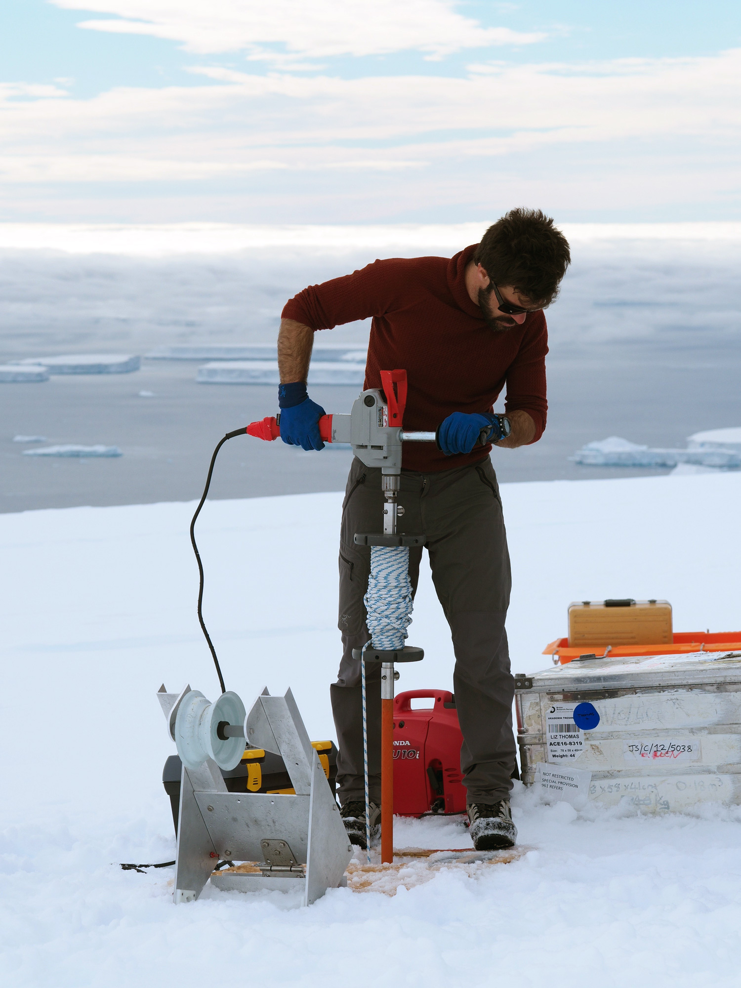 Image: Bradley Markle drilling a shallow ice core in the sub-Antarctic islands. Credit: Joel Pedro.